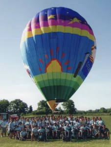 Hot air balloon behind camp