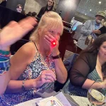 Bev with a surprised look and hand over her mouth