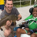 Boy with a large fish he caught