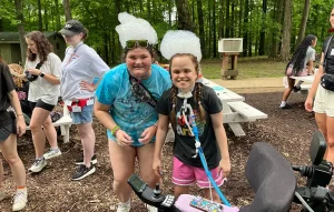 Female camper and counselor with bubble hats