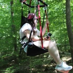 A camper on the zip line