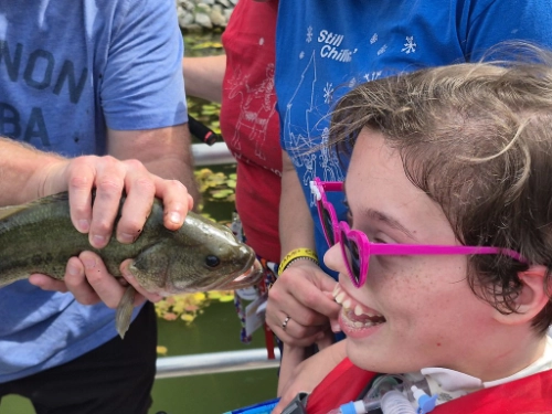 A girl meeting a fish